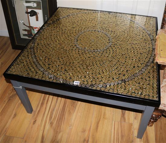 A gun cartridge coffee table, W.95cm